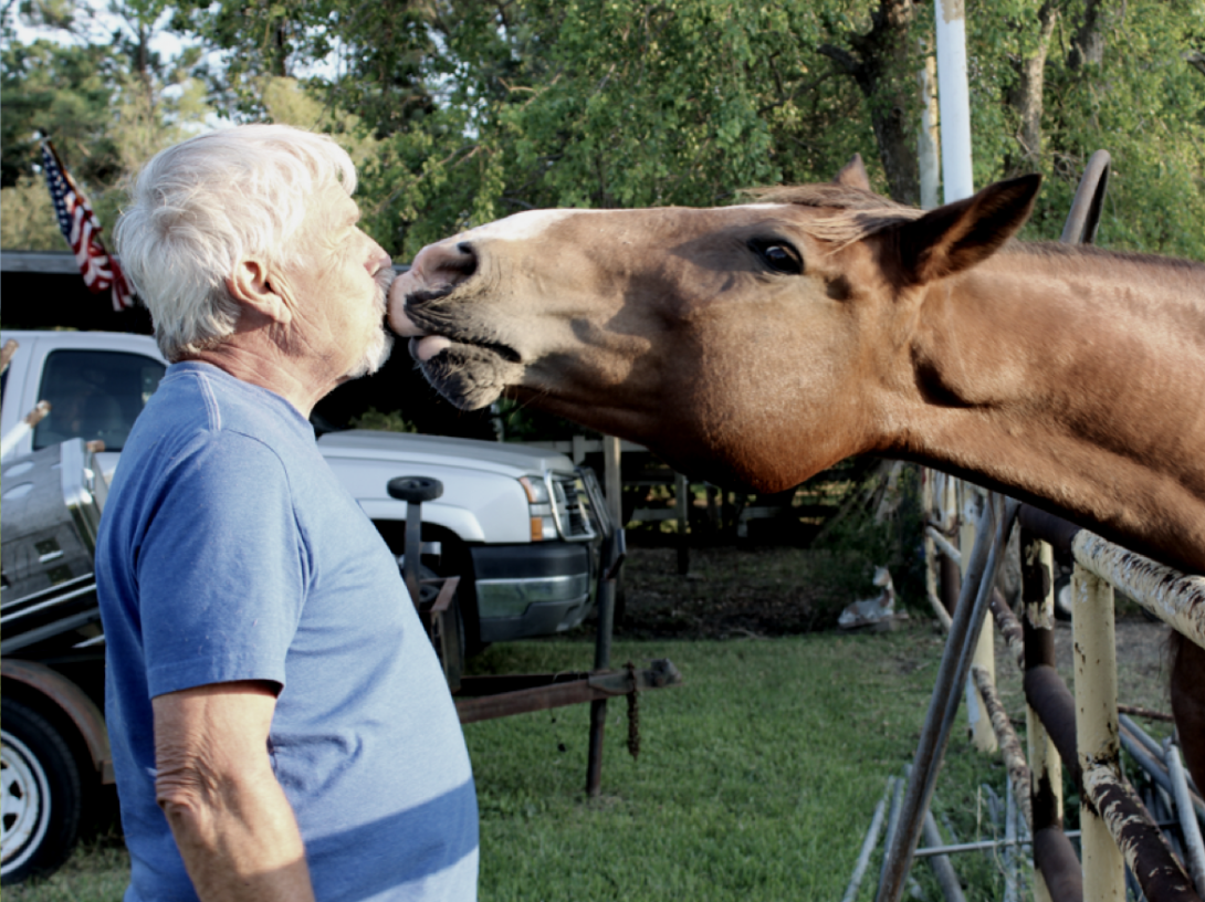 Photo of Jerry giving Pete a peppermint kiss.